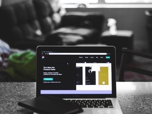 focus photo of black and white laptop computer turned on